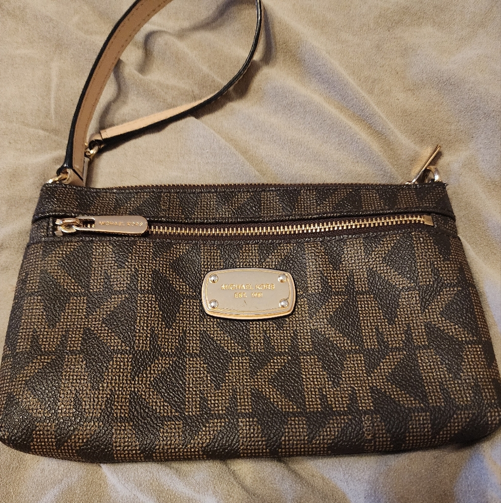Michael Kors Brown Signature Wristlet In Great Condition Missing A Body Strap.